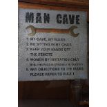 Metal man cave sign