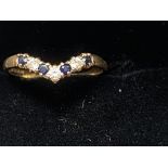 9ct Gold wishbone ring set with sapphires & cx sto
