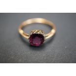 9ct Rose gold solitaire ring set with purple gem s