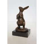 Bronze rabbit holding egg signed