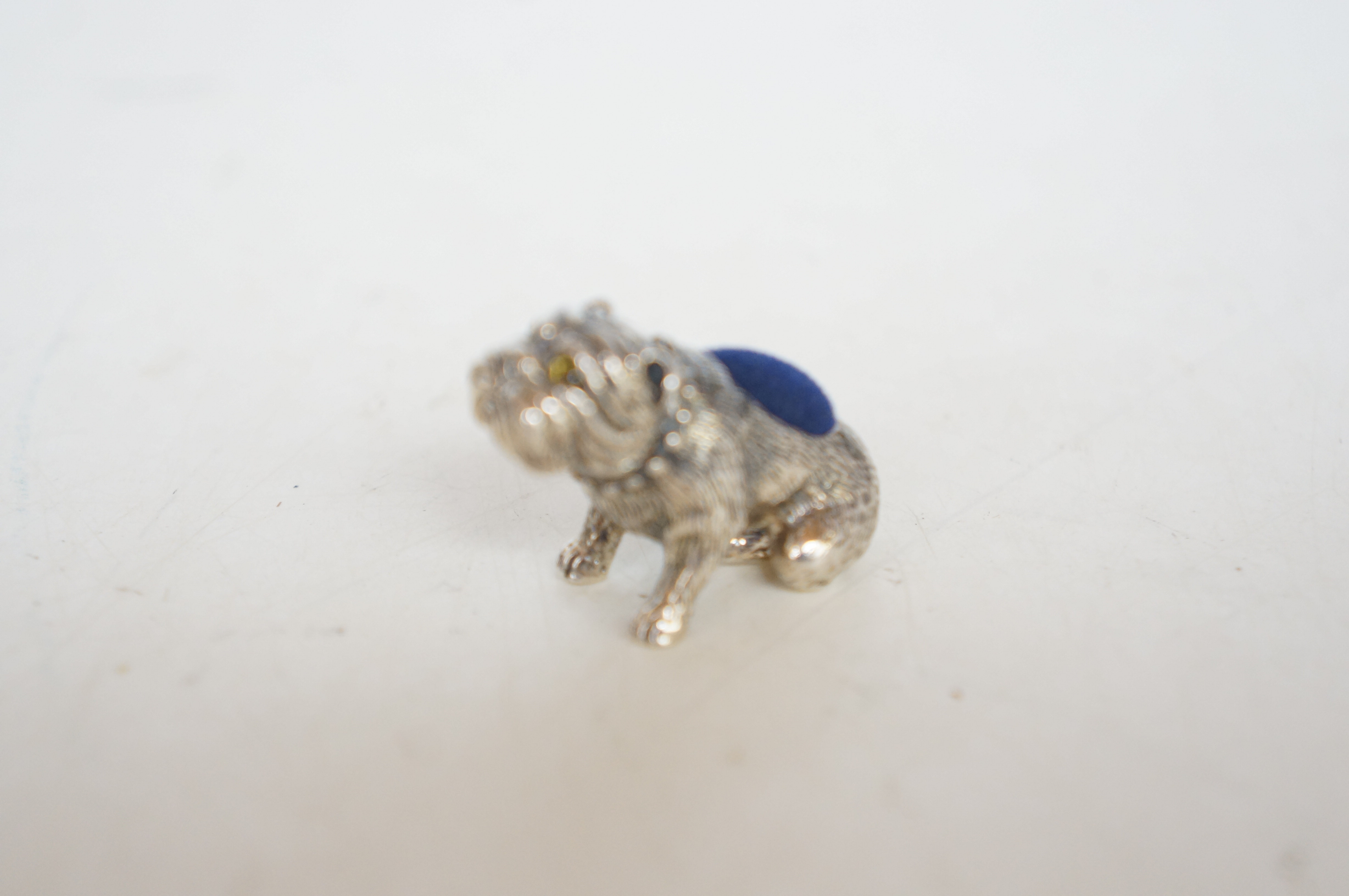 Silver bulldog pin cushion with glass eyes