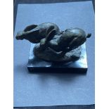 Pair of bronze hares signed