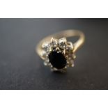 9ct Gold cluster ring with central sapphire Size L