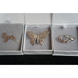 3x white metal pin brooches