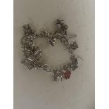 Silver charm bracelet - 12 charms