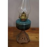 Early cast iron oil lamp with blue reservoir