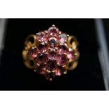 9ct gold cluster ring with purple stones Weight 4.