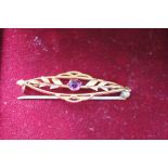 9ct Gold brooch set with red stone