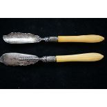 Pair of silver fish knives with monarchs head