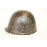 WWII helmet with leather fittings