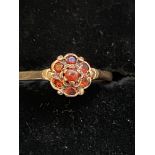 9ct Gold ring set with red stones Weight 2.1g Size