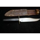 Vintage hunting knife with leather scabbard