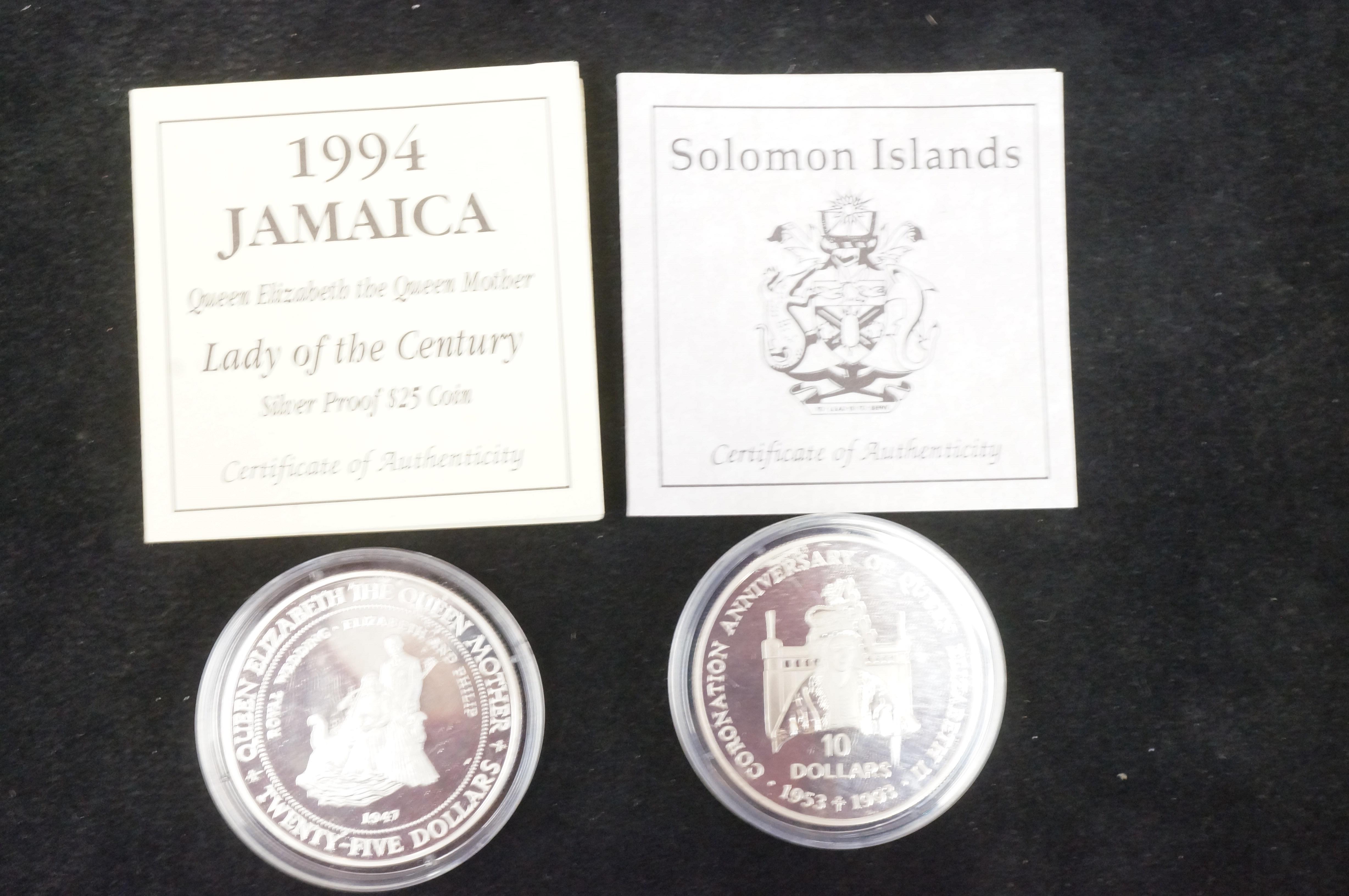 Jamaican silver 25 dollar together with a Solomons