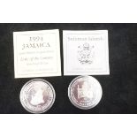 Jamaican silver 25 dollar together with a Solomons