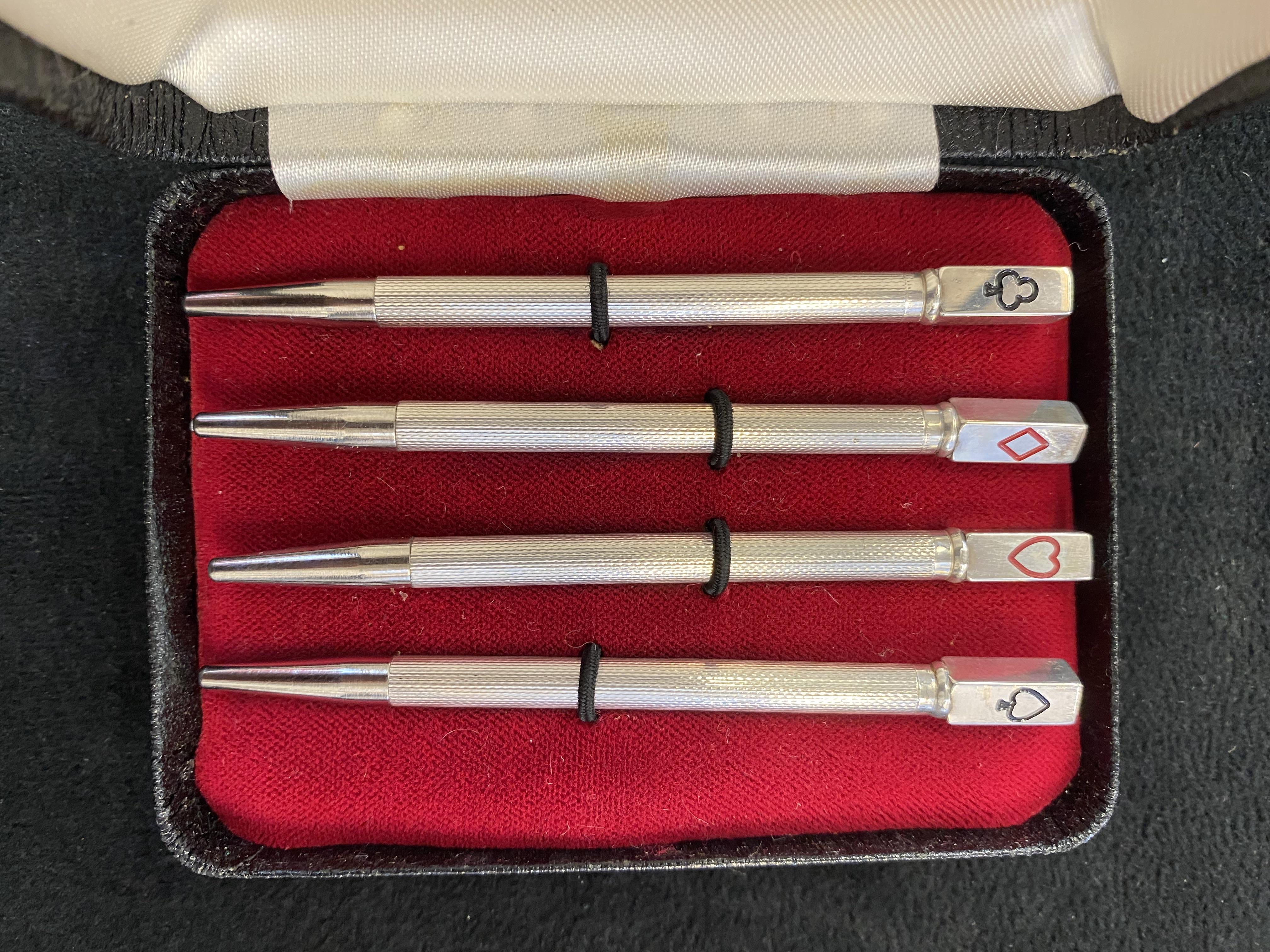 Cased set of 4 silver propelling pencils