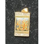 Silver gilt oriental pendant