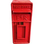 An original ER red post box with key