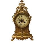 Gilt french mantle clock with pendulum & key