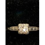 Solitaire diamond ring set on a platinum mount & g