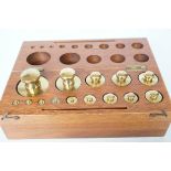 Cased set of brass weights