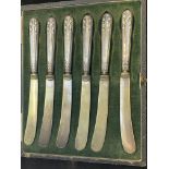 Silver butter knives in fitted case