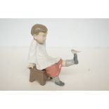 Lladro figure of a boy with bird