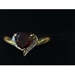 9ct Gold heart shaped ring set with red garnet & d