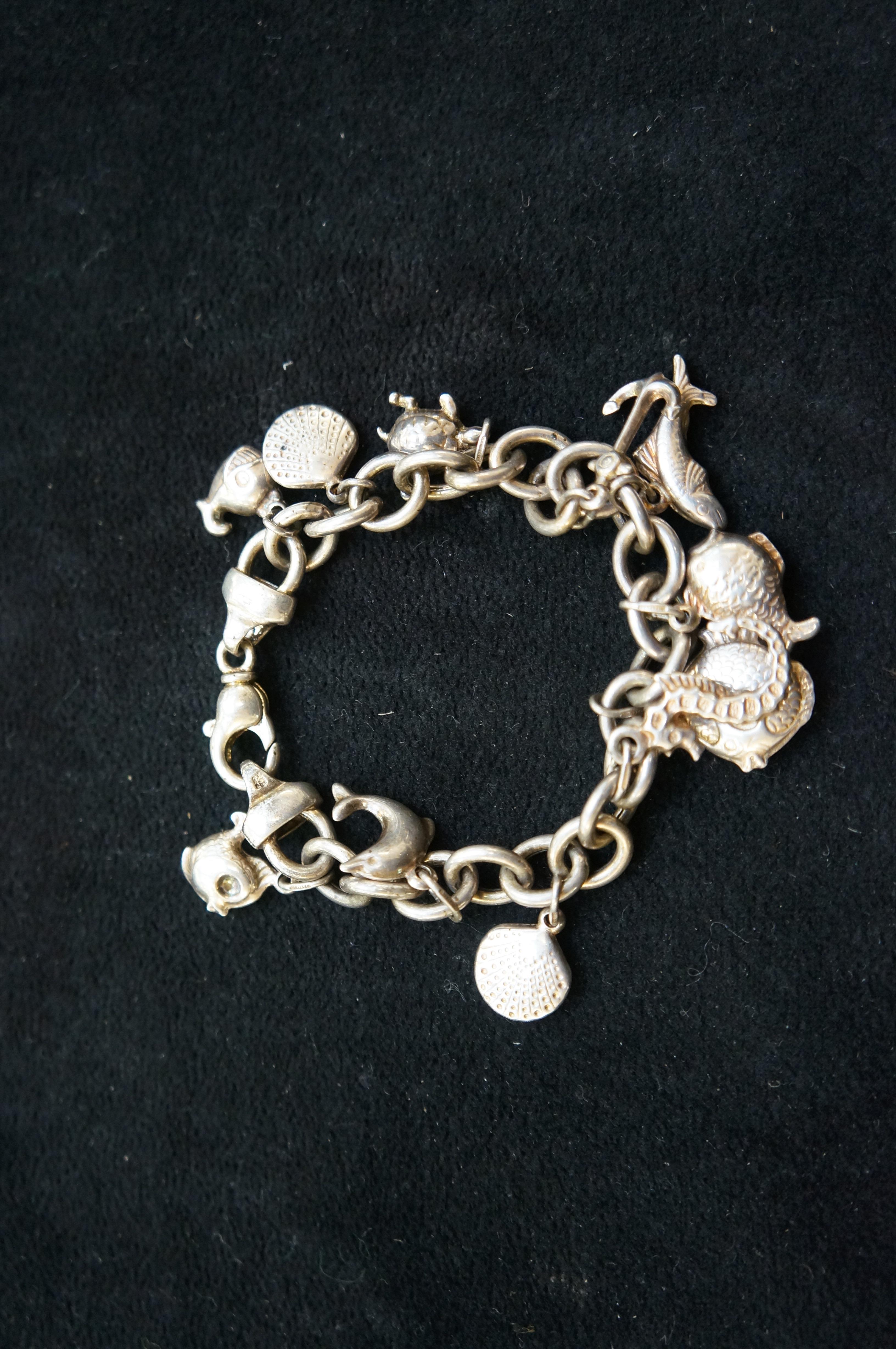 Silver charm bracelet with 11 charms
