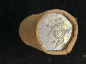 Tube of 1977 coins