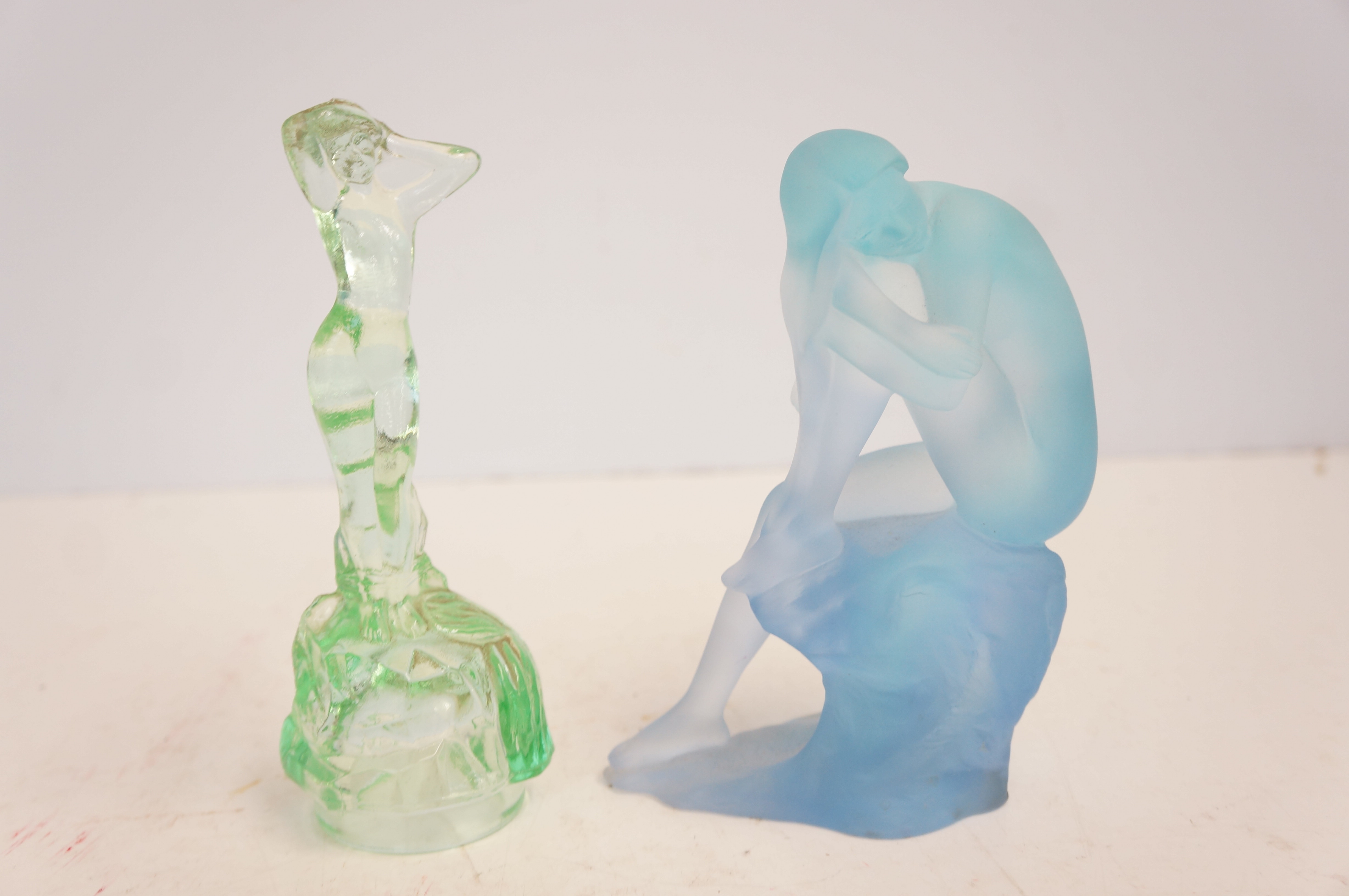 Blue frosted glass figure of a nude lady together