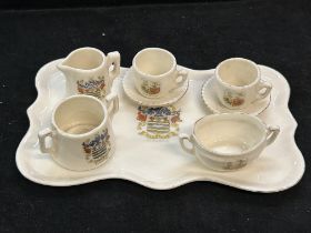 Miniature crested ware tea set on tray