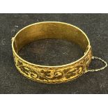 Gold bangle with metal core. Total weight 50.6 gra