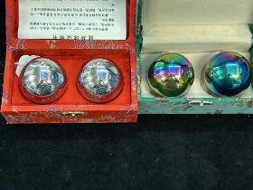 Two pairs of boxed Chinese stress balls