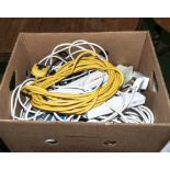 A box containing extension leads and adapters