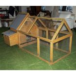 A wooden chicken coop/house and run