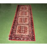 A red wool runner 80cm x 250cm