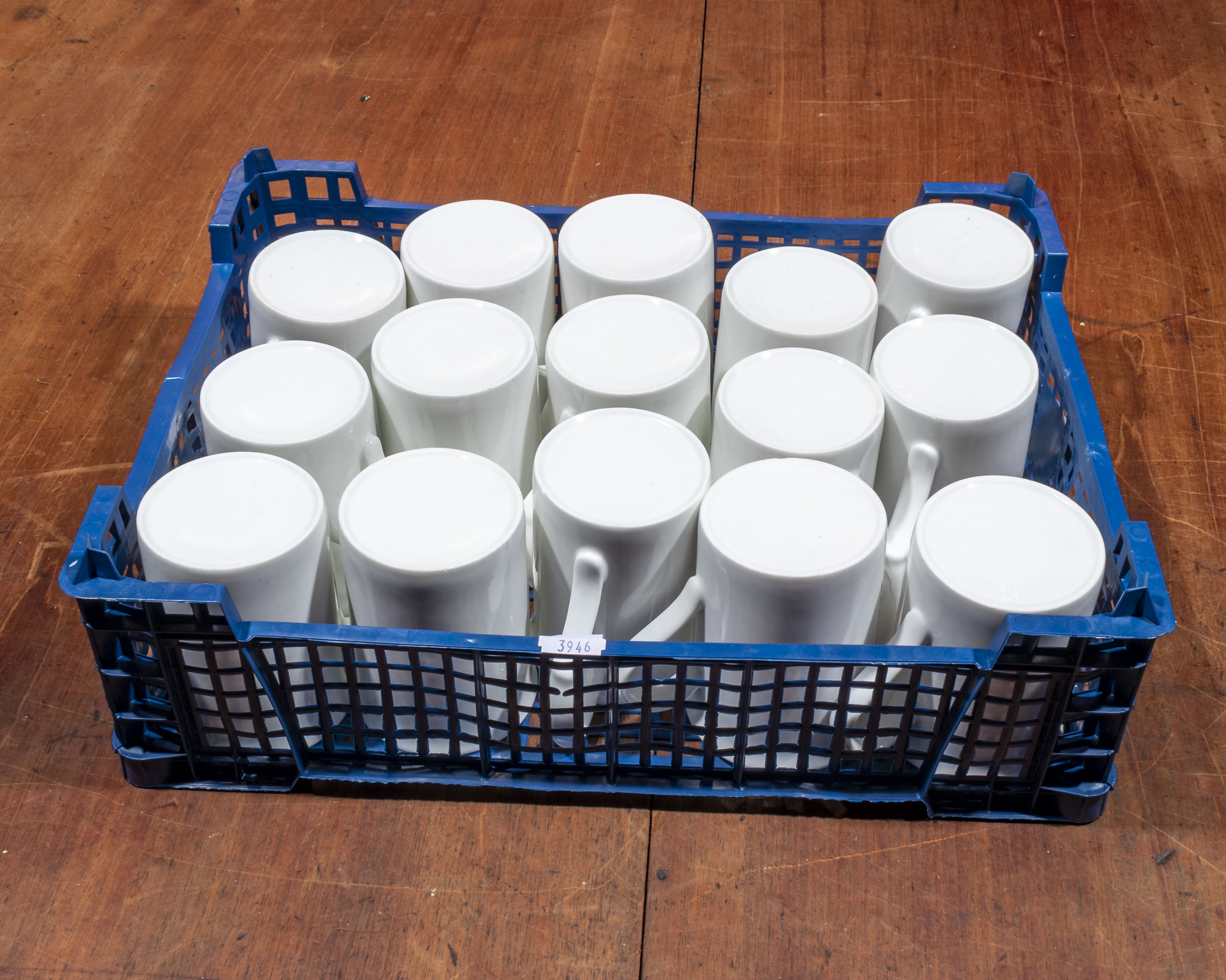 A tray of white coffee mugs
