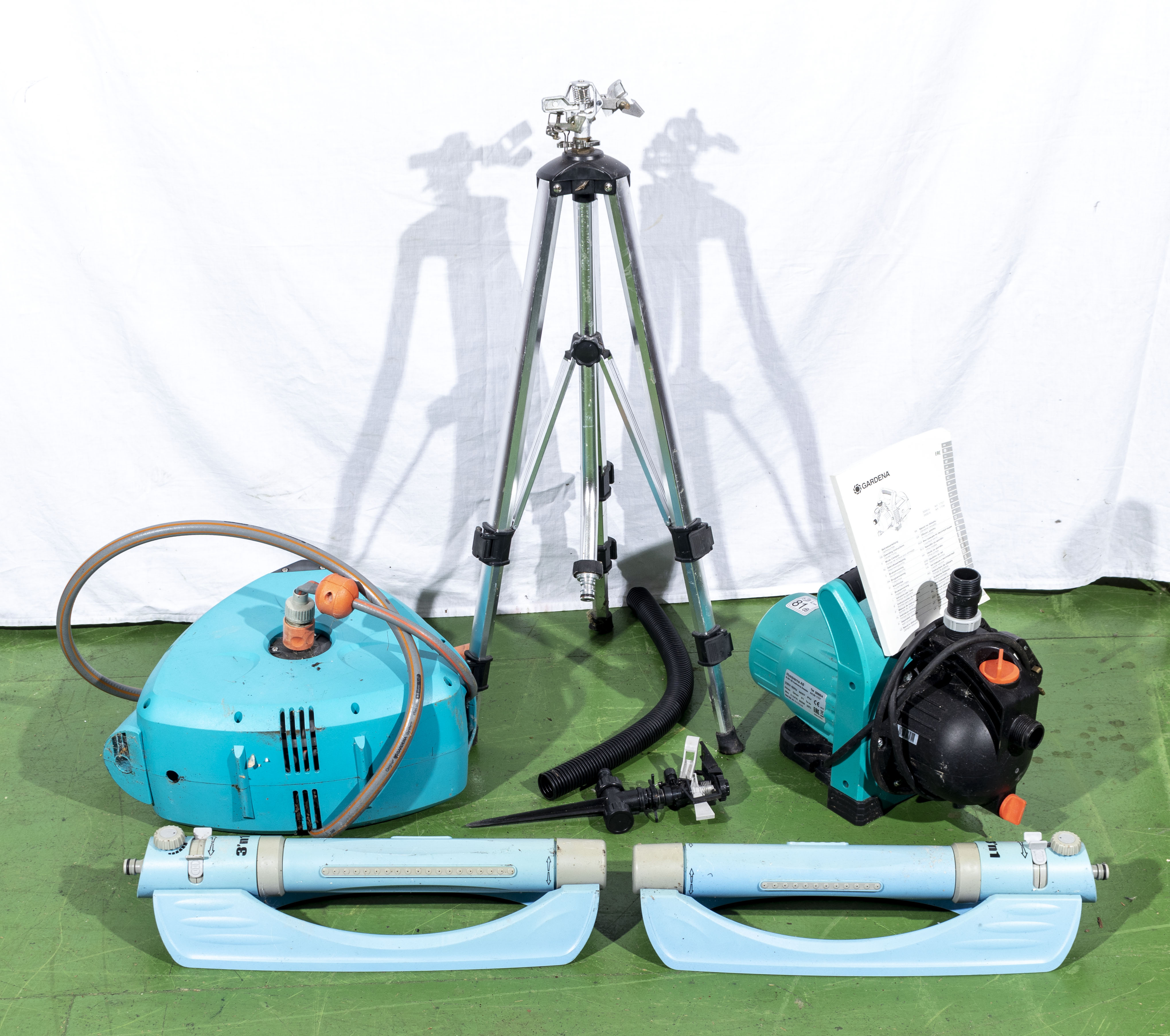 A Gardena hose reel, garden pump and irrigation equipment