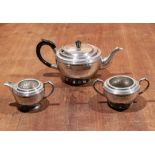 A three piece pewter tea service