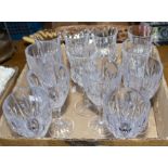 Two sets of six wine glasses