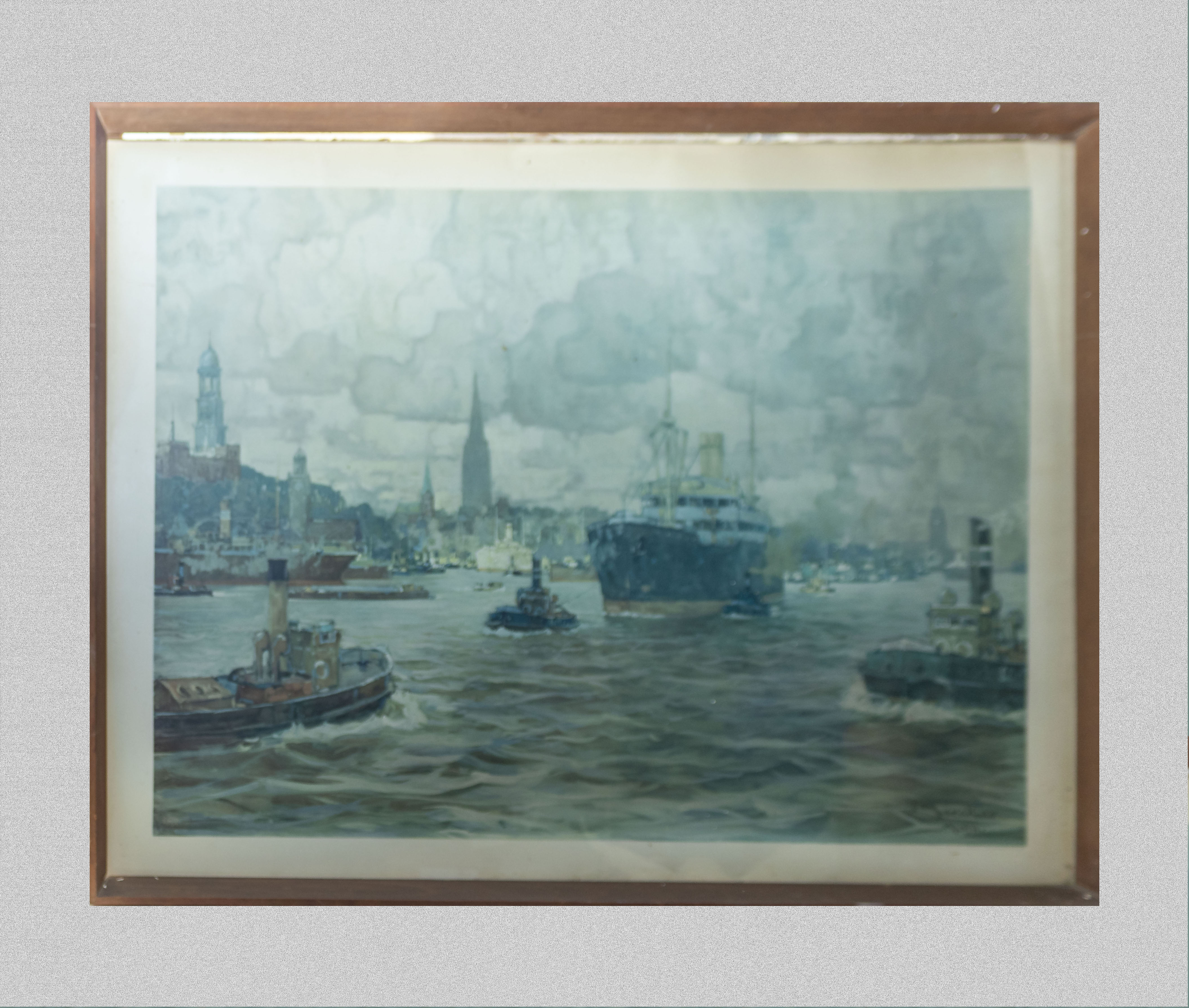 A large framed print of a harbour scene