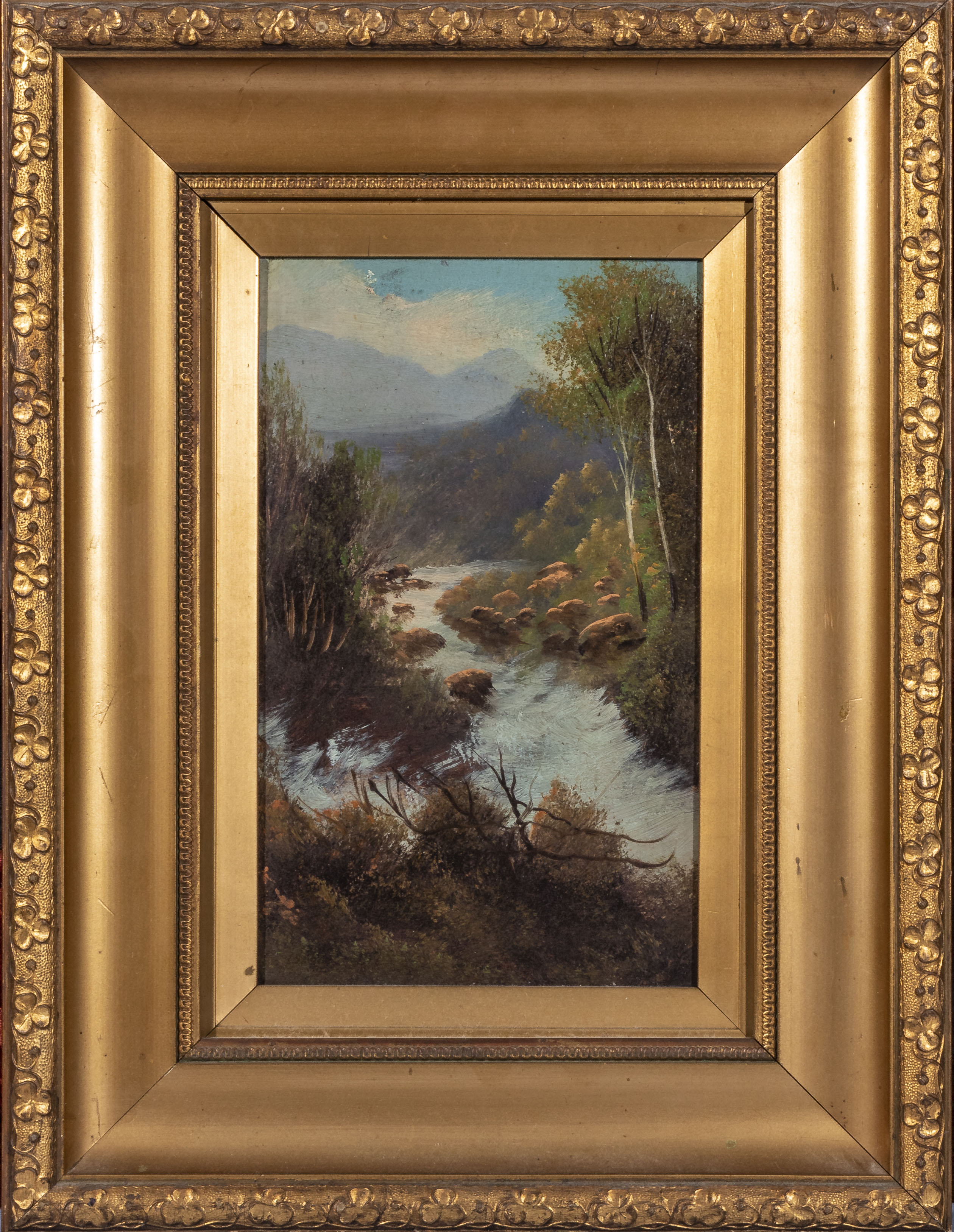 A small gilt framed oleograph depicting a river scene, overall size 43cm x 33cm