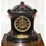 A Victorian slate mantle clock with front escapement dated 1875