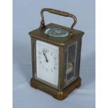 A small brass carriage clock the movement is stamped Paris EGL