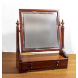 An Edwardian mahogany toilet mirror with drawer