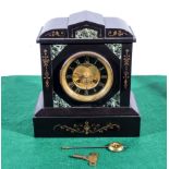 A slate and marble mantle clock with brass dial