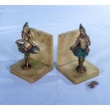 A pair of german Art Deco painted metal bookends, hand broken from one piece