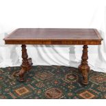 A Victorian mahogany library table with leatherette insert top