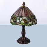 A small Tiffany style table lamp