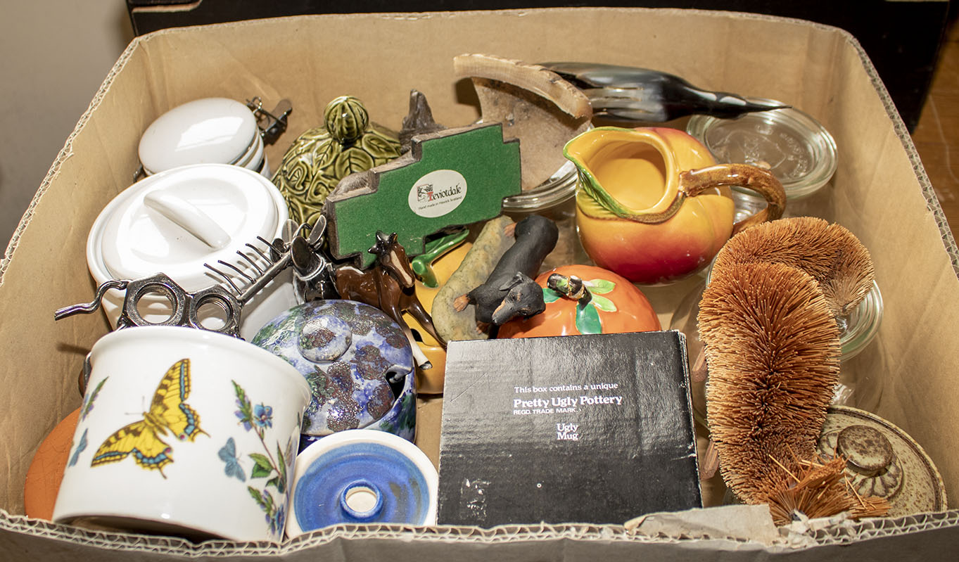 A box containing assorted collectables